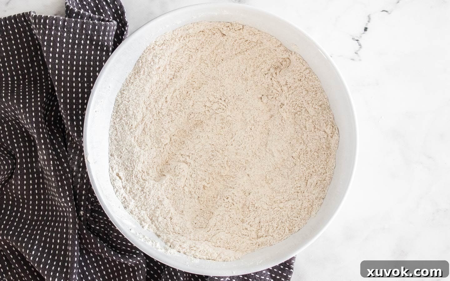Dry ingredients for shortbread crust perfectly blended in a mixing bowl.