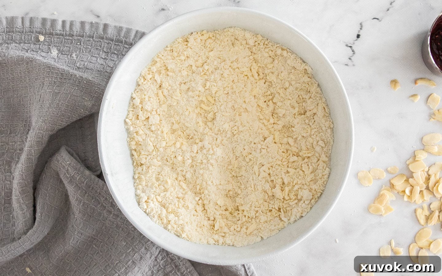 The butter cut into the flour mixture, showing a breadcrumb-like consistency.