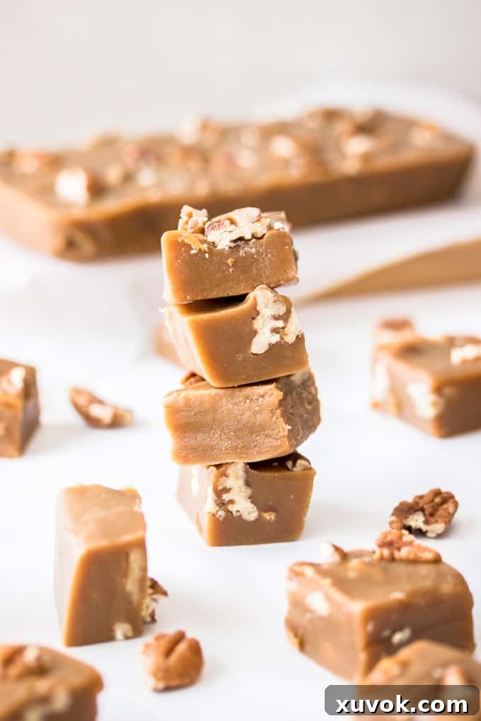 A stack of pecan fudge squares surrounded by more