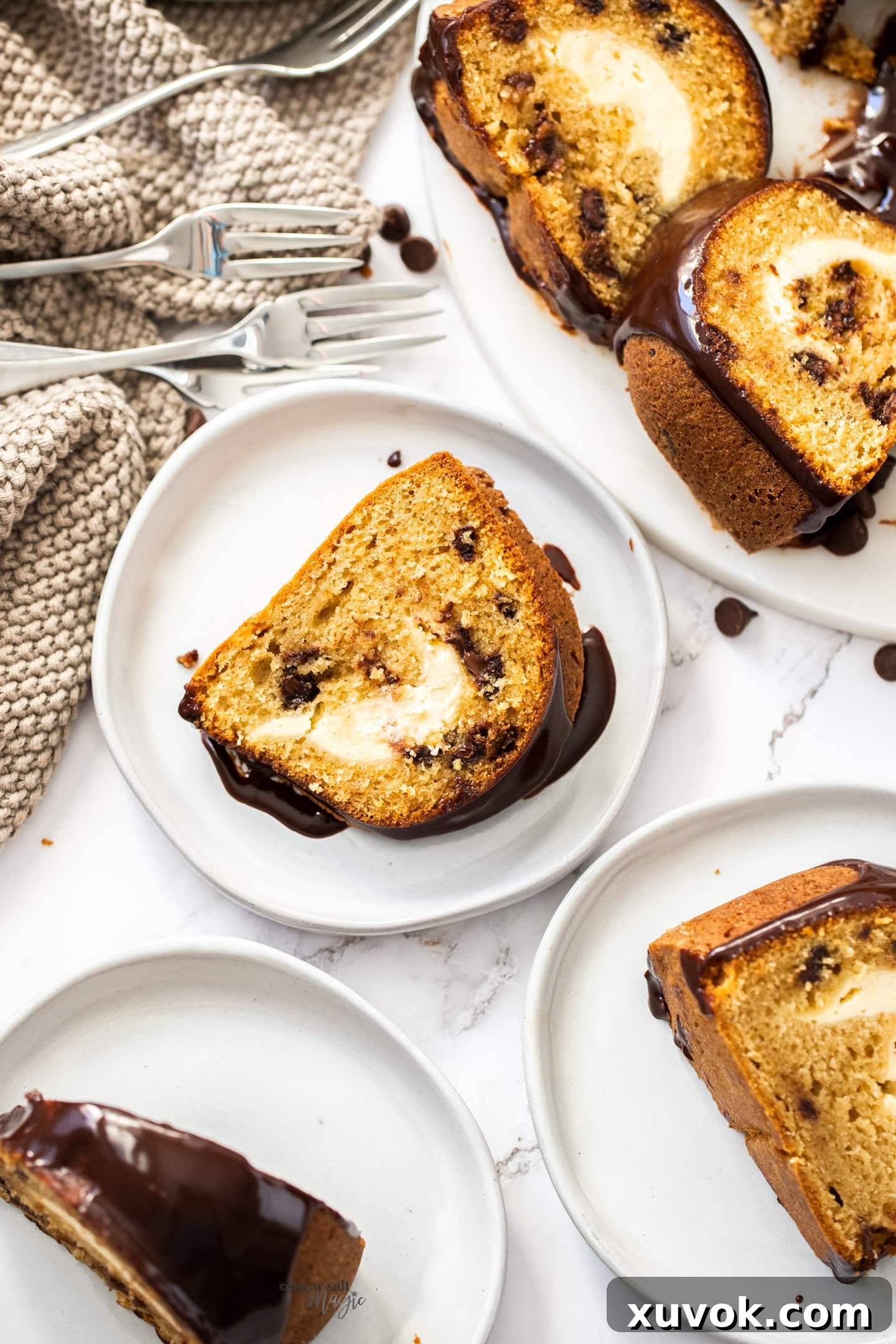 Slices of chocolate chip bundt cake on small dessert plates.