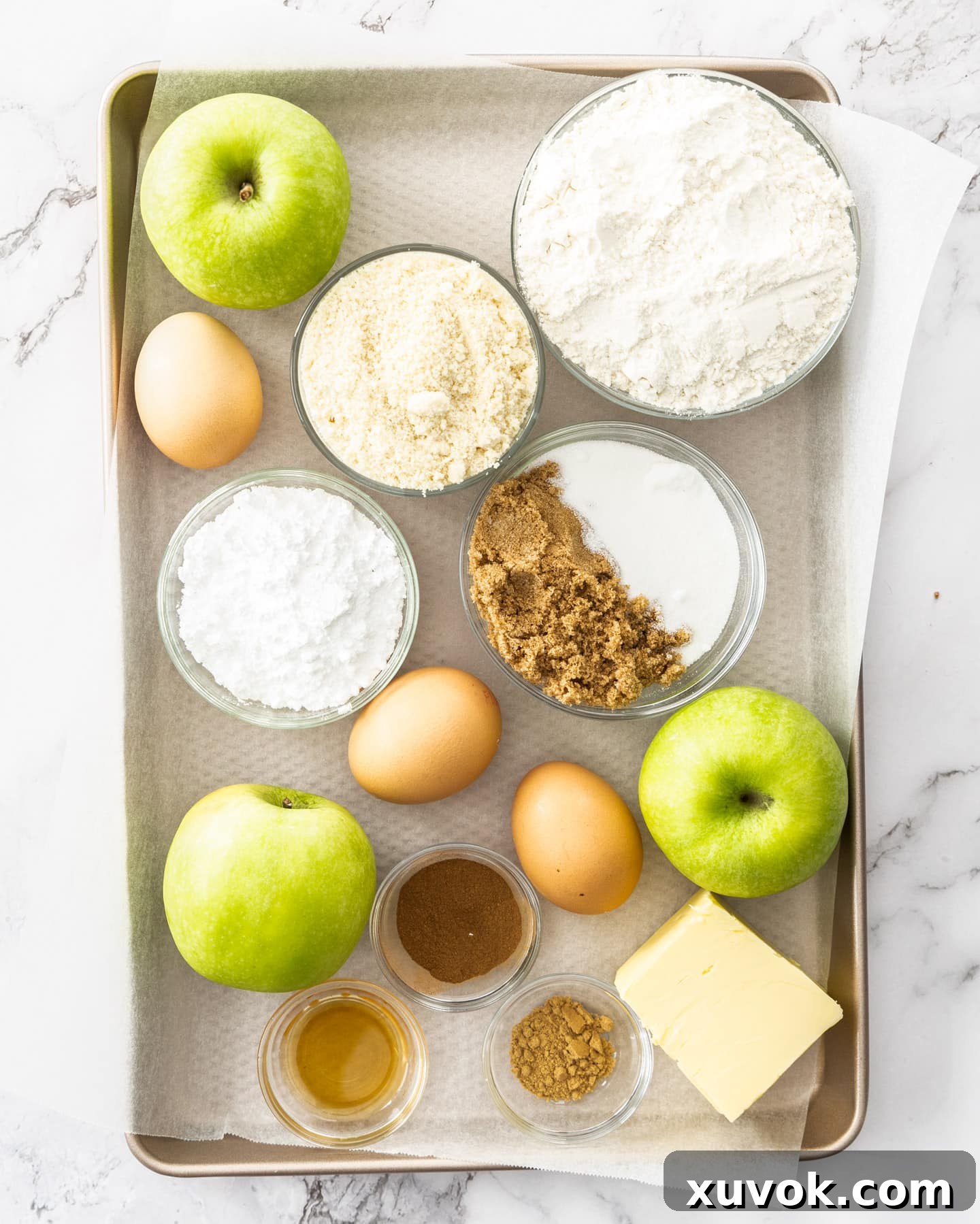 A visual display of all the fresh ingredients needed to bake the delicious apple frangipane tart.
