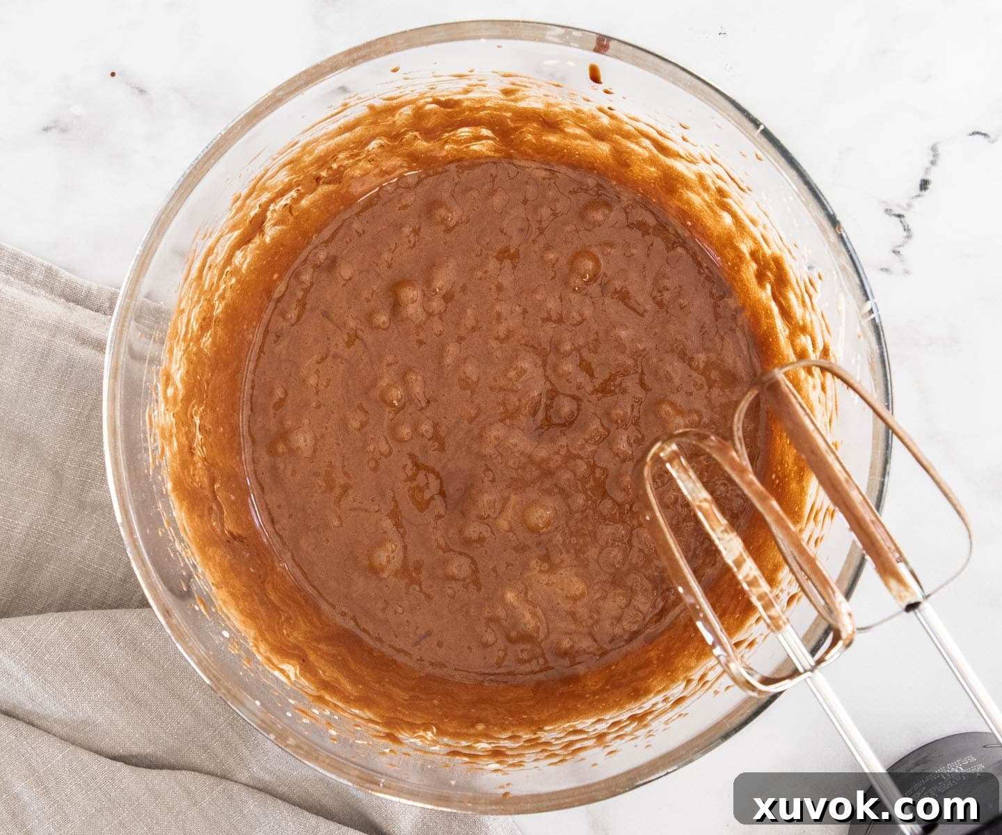 The chocolate butter mixture successfully beaten into the aerated egg and sugar mixture.