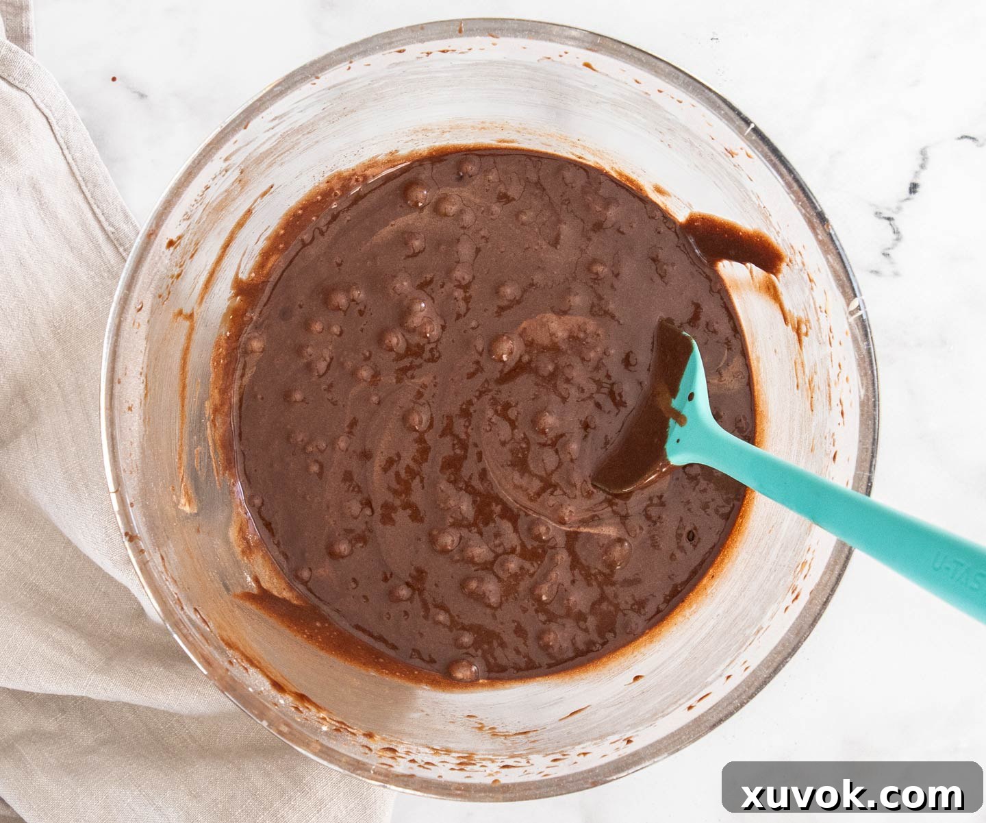 The brownie batter in a bowl, ready for the chocolate chips to be folded in.