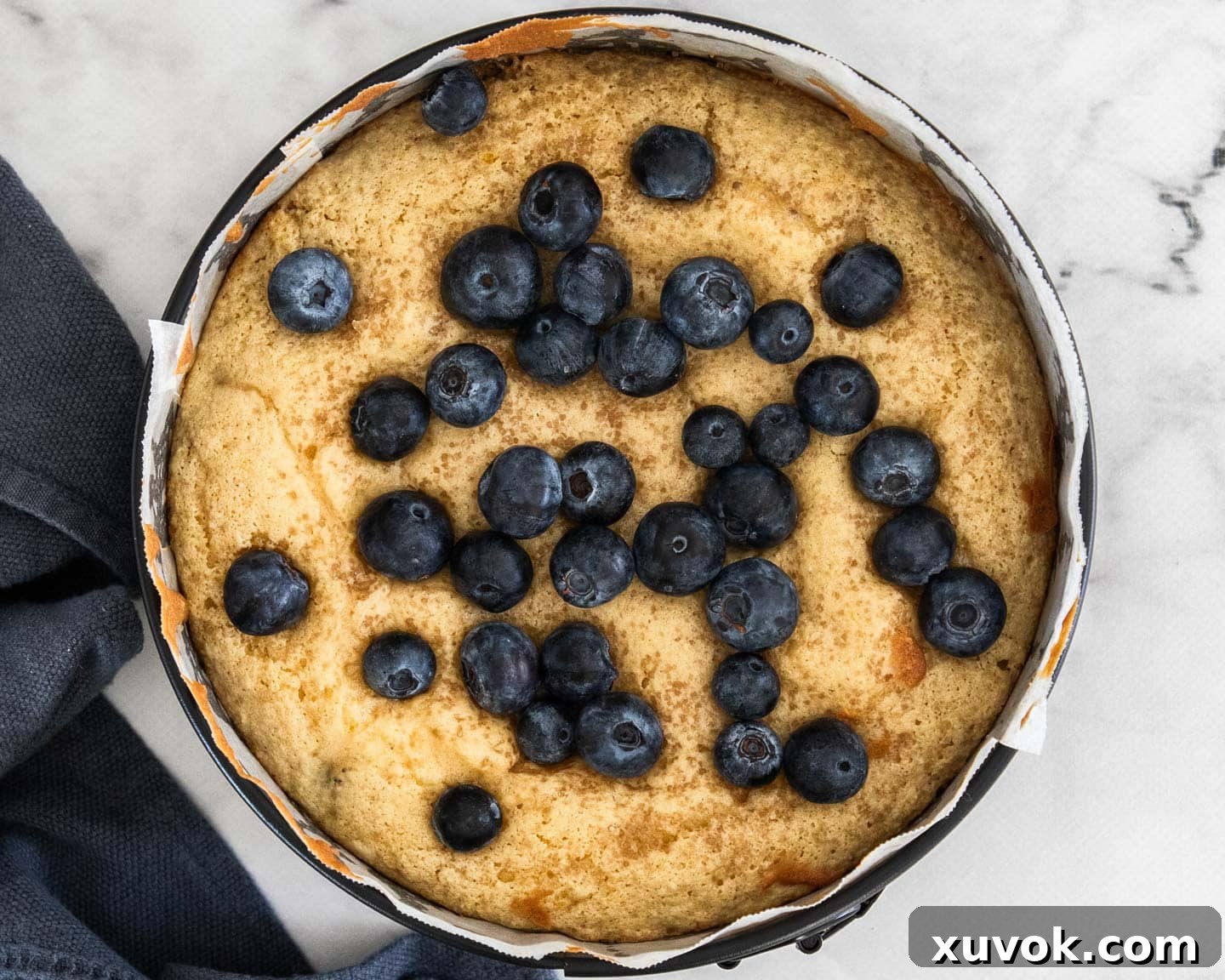 The blueberry cake half way through baking with the extra blueberries added.