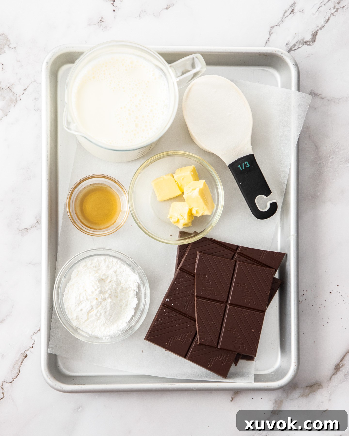 Ingredients for chocolate pots on a baking tray.