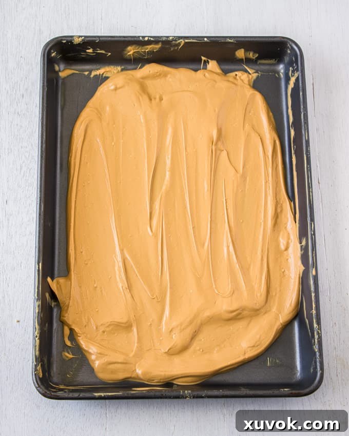 A close-up of beautifully caramelised white chocolate, showing its rich, even color.