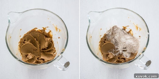 A glass bowl with dough for speculoos cookies in it