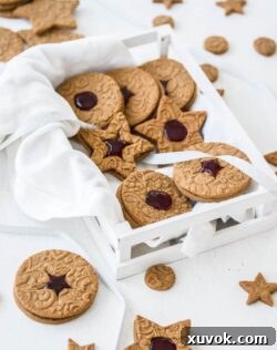 These Jam Filled Speculaas cookies (also known as speculoos cookies) are crunchy, full of warming spices and easy to make. They’re sandwiched together with strawberry jam and make the perfect Christmas cookie.