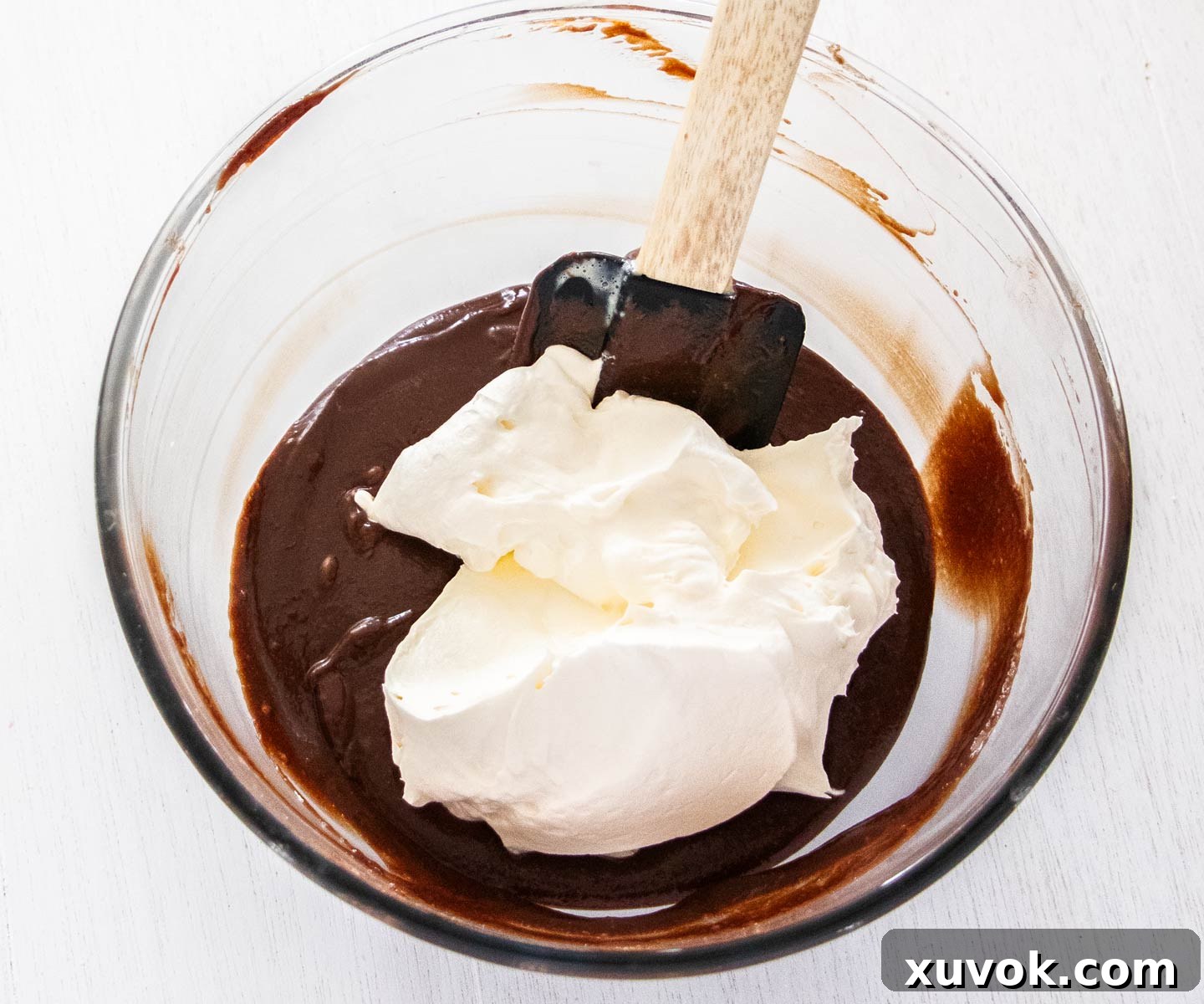 Whipped cream ready to fold into the chocolate custard.