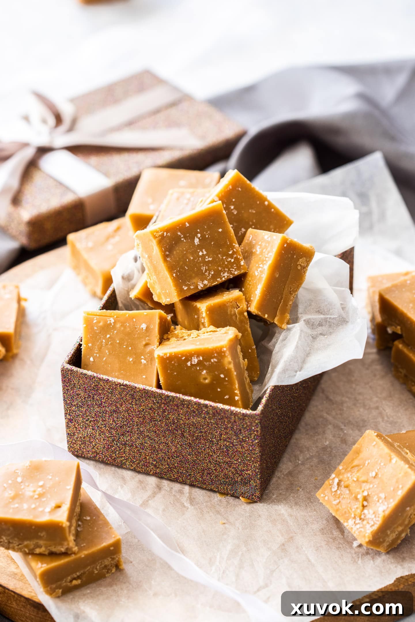 A gift box filled with perfectly cut squares of salted caramel fudge, ready for sharing.