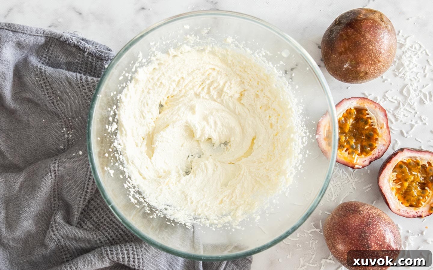 The butter, oil, and sugar mixture beaten to a light and creamy consistency in a bowl.