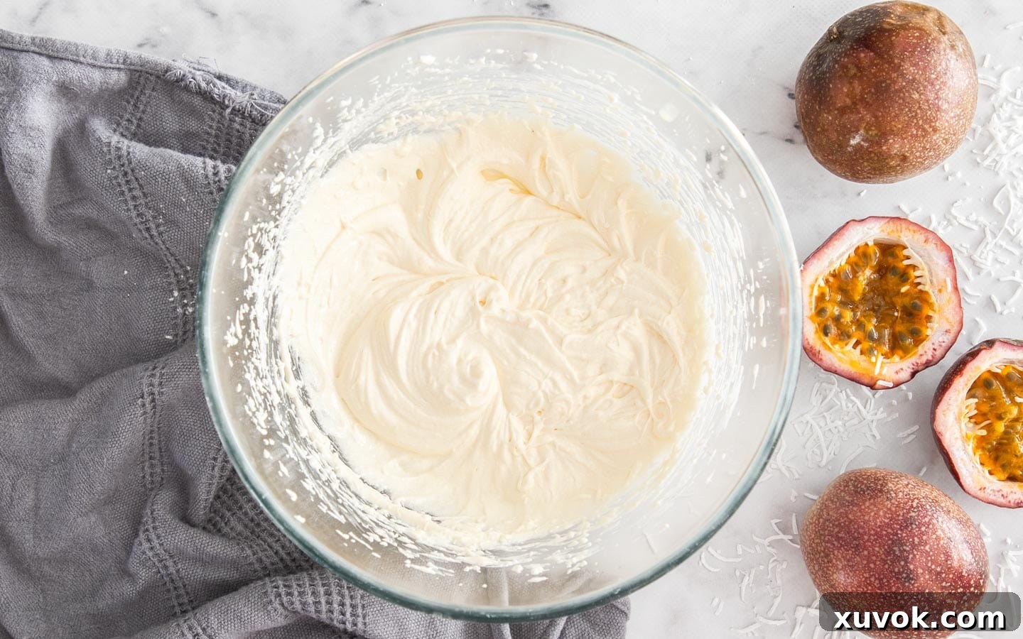 The cupcake batter after the eggs have been beaten in, showing a smooth, well-combined mixture.