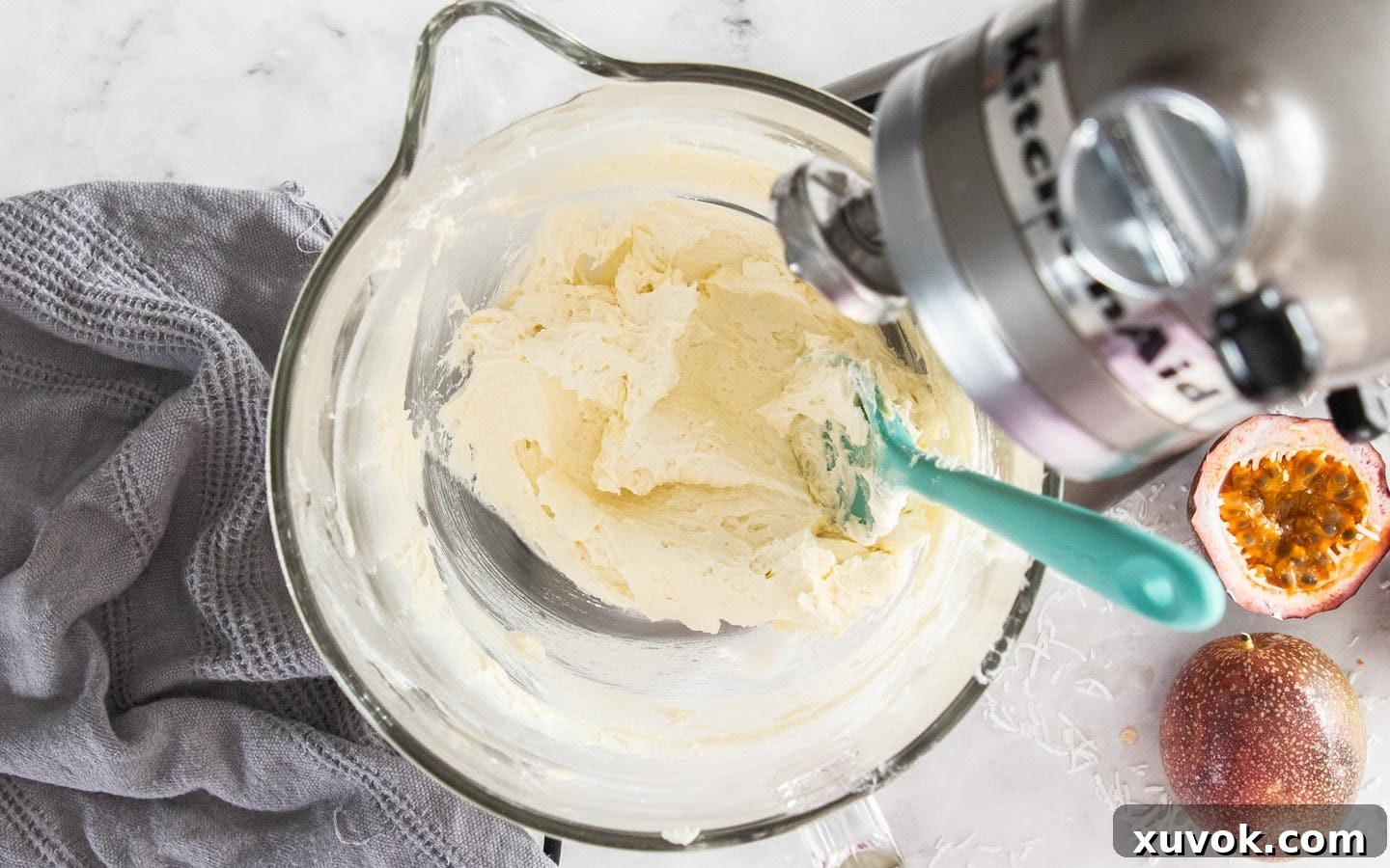 The finished coconut ermine buttercream, whipped to a smooth, pipeable consistency in a bowl.