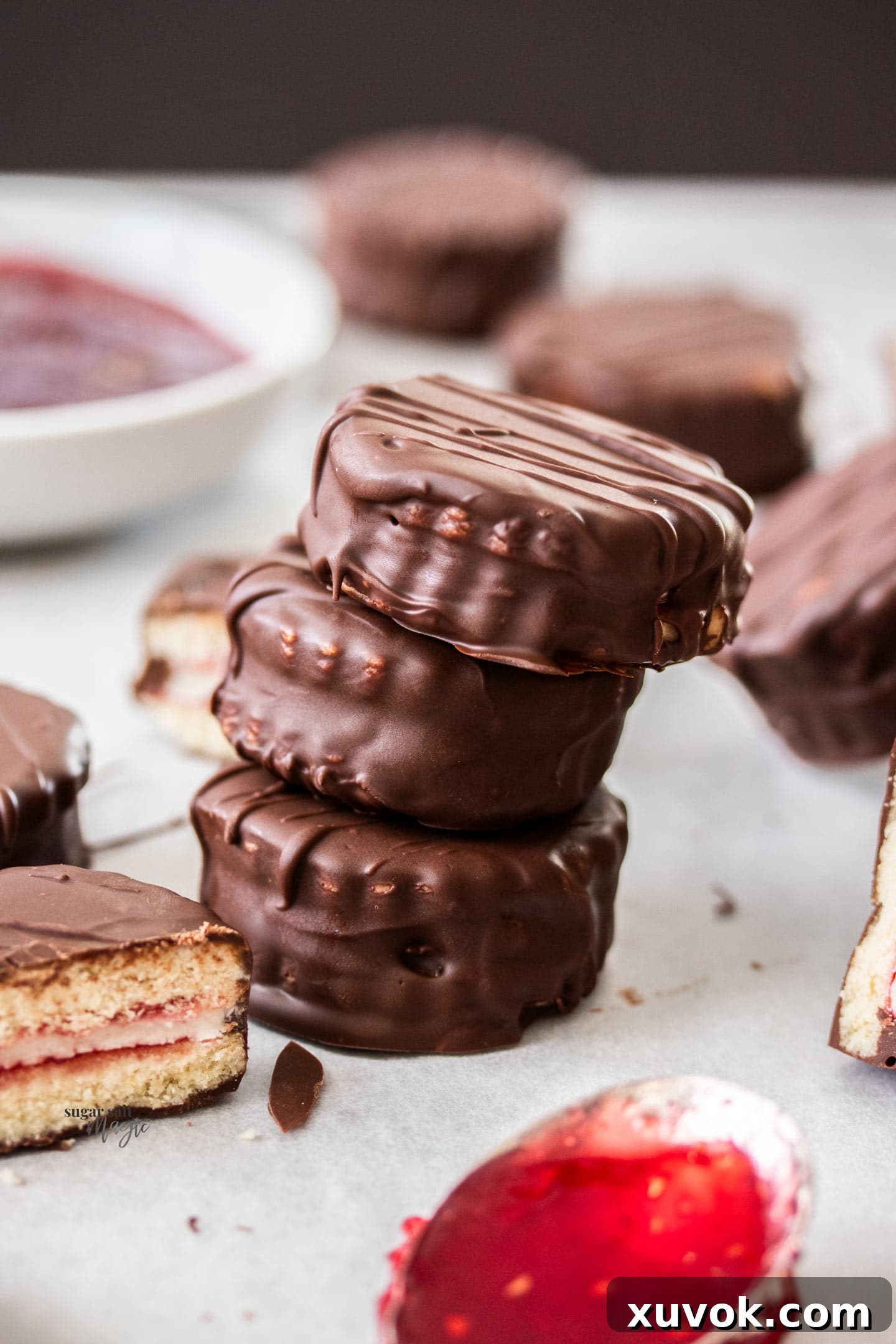 A stack of 3 mini homemade wagon wheels, showcasing the layers and chocolate coating.