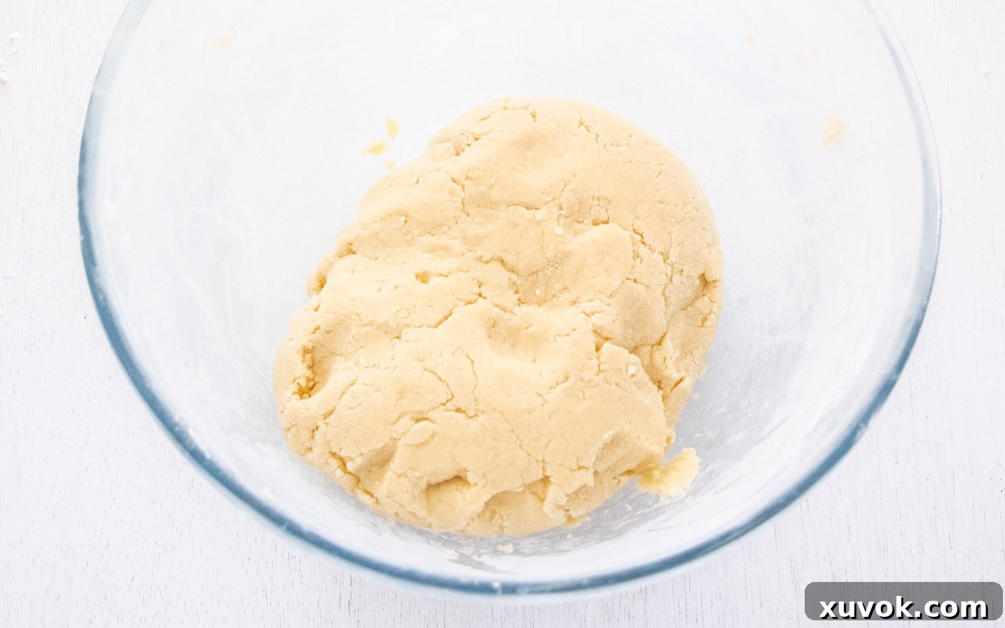 The cookie dough neatly pulled together into a cohesive ball.
