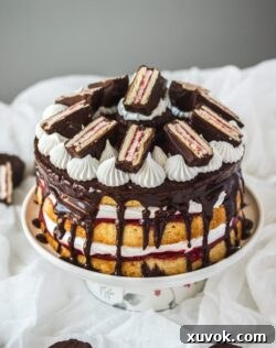 This Wagon Wheel Cake with its marshmallow frosting, vanilla sponge cake, jam and mini wagon wheels is so much fun and makes a brilliant Australia Day cake.