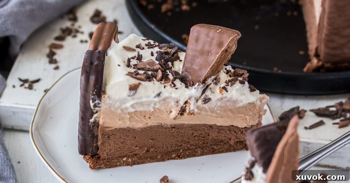 A slice of no bake Tim Tam cheesecake on a white plate