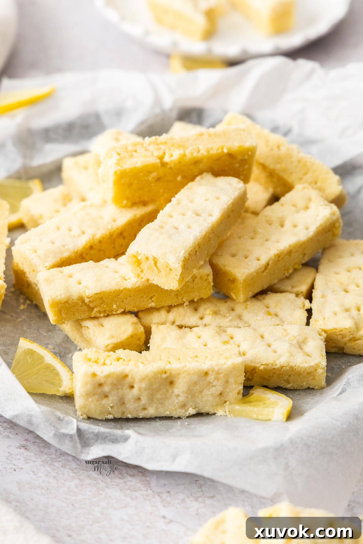 Closeup of the side of the lemon shortbread showing its delicate, buttery texture.