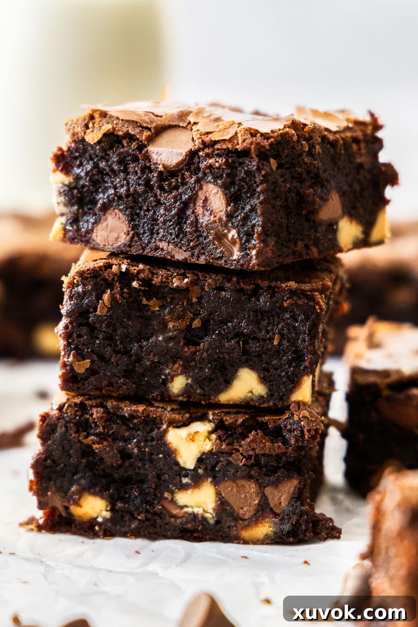A stack of 3 triple chocolate brownies.