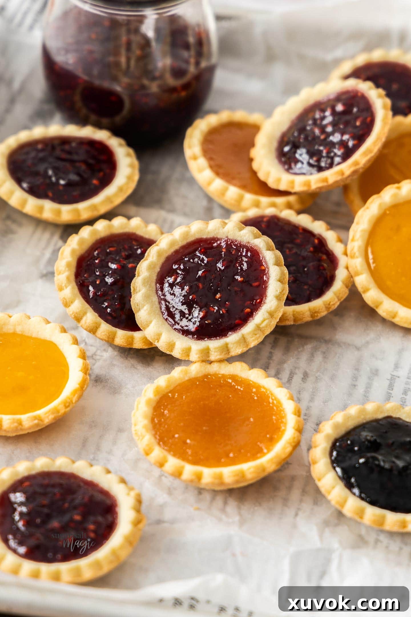 A batch of jam tarts on a serving tray.