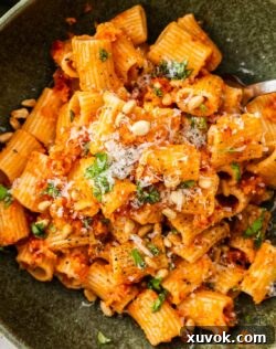Top down view of a bowl of sun dried tomato pesto pasta.