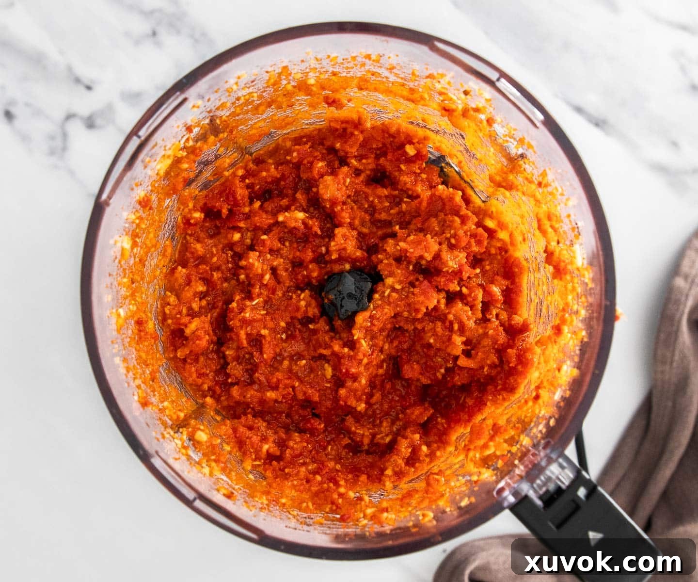 The tomato pesto in a food processor bowl.